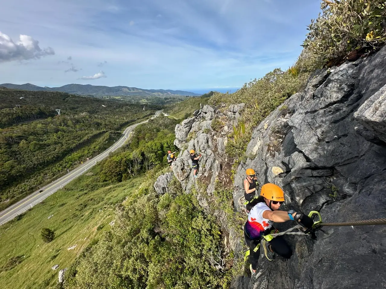 Climber traversing a via ferrata